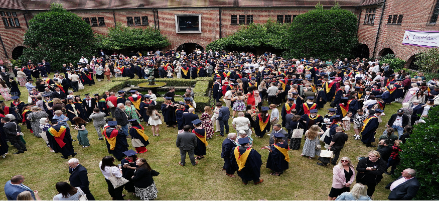Graduate on lawn - banner